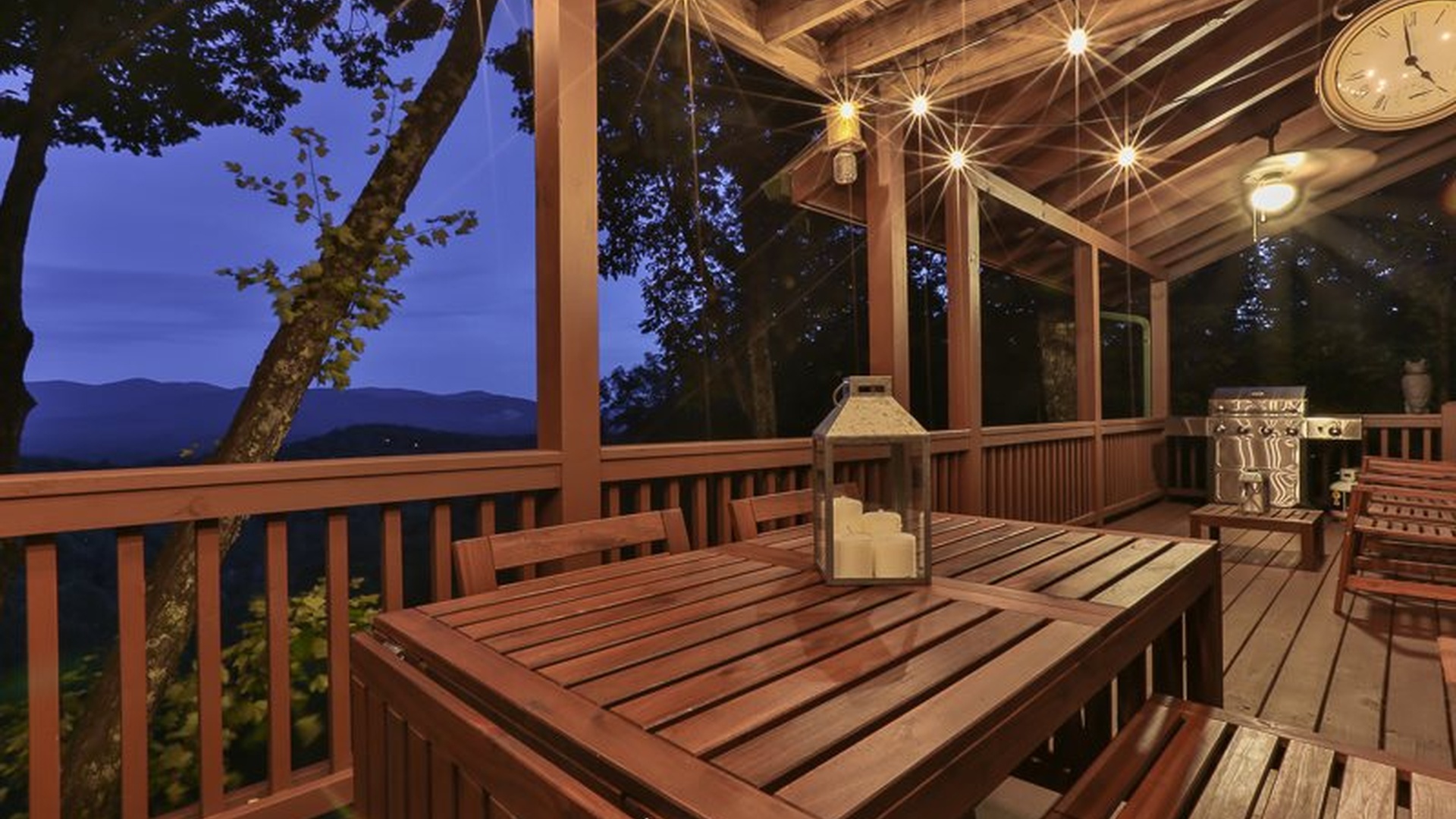 Main level deck with outdoor dining and propane grill.